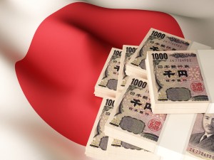 Imagem de notas de iene e uma bandeira do Japão
