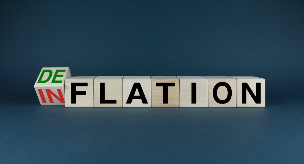 Blocos formando a palavra "deflação"