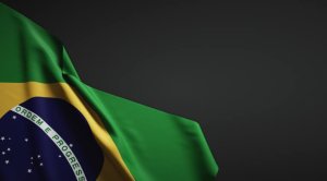 detalhe de bandeira do Brasil sobre fundo escuro