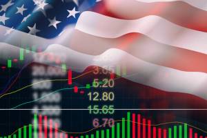 bandeira dos EUA sobre tela de cotações de ações