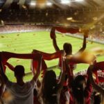 Imagem de torcedores em um campo de futebol durante a Copa do Mundo